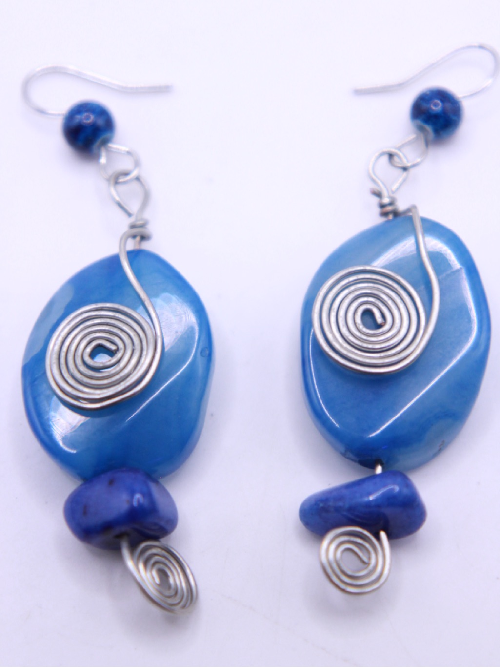 Blue Dyed Stone With Handmade Silver Tone Spiral Accent.
